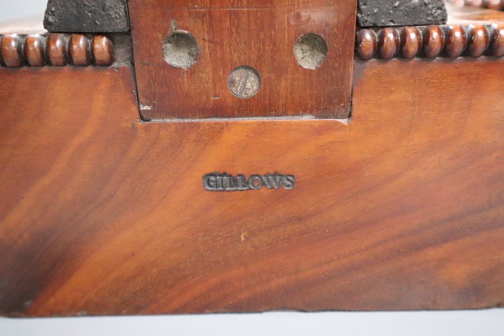 A pair of 19th century mahogany veneered plate stands stamped Gillows, 48cm high